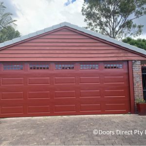 Manor Red Hampton Sectional door with County windows