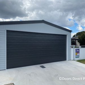 uscan-Monument-Sectional-Door-Carport