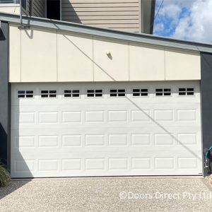 Surfmist Oxford Sectional Door with County tinted windows